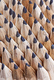 rows of sharpened black graphite pencils
