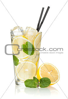 Glass of lemonade with lemon and mint