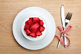Valentine's day gift box on plate and silverware