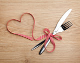 Valentine's Day heart shaped red ribbon and silverware
