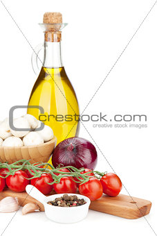 Fresh ingredients for cooking: tomato, mushroom and spices