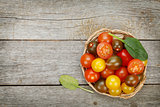 Colorful cherry tomatoes on wooden table