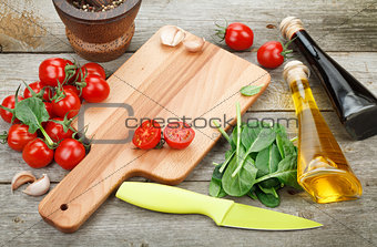 Fresh ingredients for cooking: pasta, tomato, salad and spices