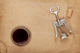 Wine glass, cork and corkscrew with red wine stains