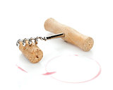 Cork and corkscrew with red wine stains