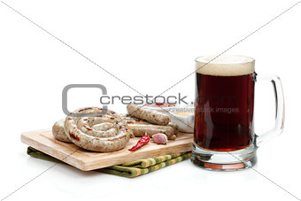 Grilled sausages with ketchup, mustard and mug of beer