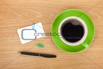Blank business cards over office table with supplies