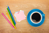 Blank post-it with office supplies and coffee cup