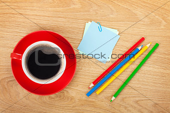 Blank post-it with office supplies and coffee cup