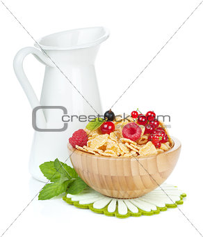 Fresh corn flakes with berries and milk jug