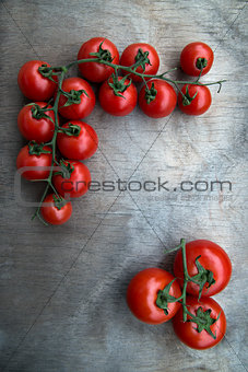 fresh red delicious tomatoes  on an  old wooden tabletop backgro