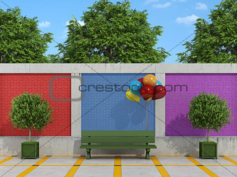 Street with bench and colorful balloons