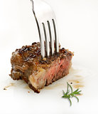 Piece Of Red  Meat Steak On A Fork