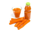 Carrots and juice in a glass and bottle