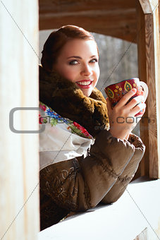 Russian woman in a scarf and coat