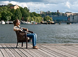 girl sitting in the pier