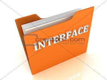 INTERFACE bright white letters on a orange folder