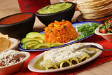 Traditional mexican green enchilada dinner