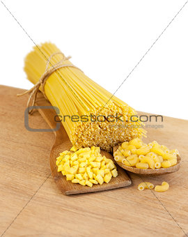 pasta on a wooden board on a white background