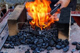 blacksmith furnace with burning coals 