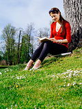 Woman reading outdoors