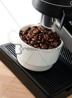 coffee maker machine with white coffee cup