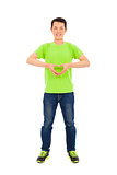 smiling young man make a heart gesture