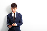  young male executive using digital tablet