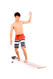 young  surfer practice surfing pose