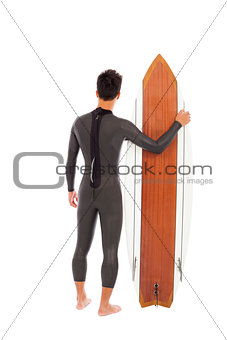 surfing man wore wet suit and holding surfing board