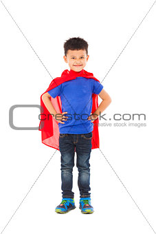 confident Superhero kid standing in studio