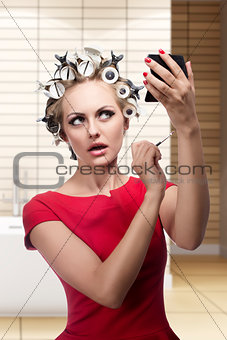 funny woman with hair rollers 