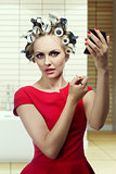beauty makeup girl with hair rollers 