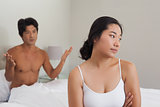 Couple having an argument in bed