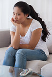 Bored woman sitting on couch