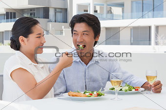 Happy couple having a meal together