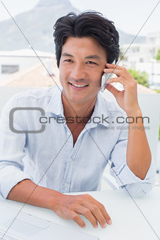 Happy man talking on phone