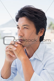 Thinking man with hands together