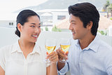 Happy couple having white wine
