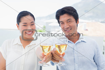 Happy couple having white wine