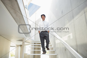 Man walking with hands in pockets
