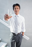 Happy man holding flute of champagne