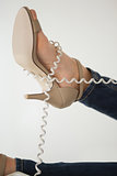 Phone cord wrapped around womans foot