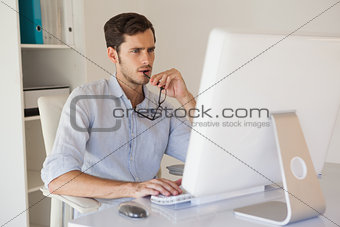 Casual businessman working at his desk