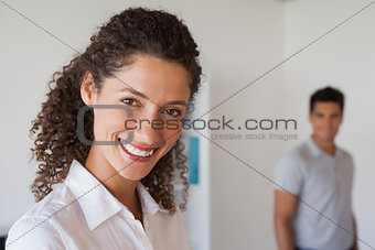 Casual business partners smiling at camera