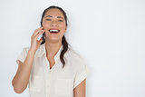 Casual businesswoman laughing on the phone