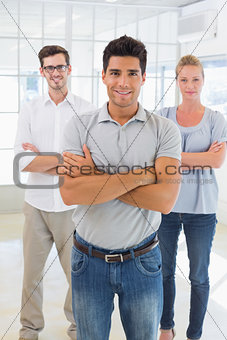 Casual business team smiling at camera