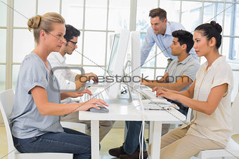 Casual business team working on computers