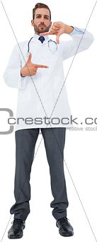 Handsome young doctor gesturing with hands