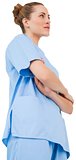 Pretty surgeon in blue scrubs with arms crossed